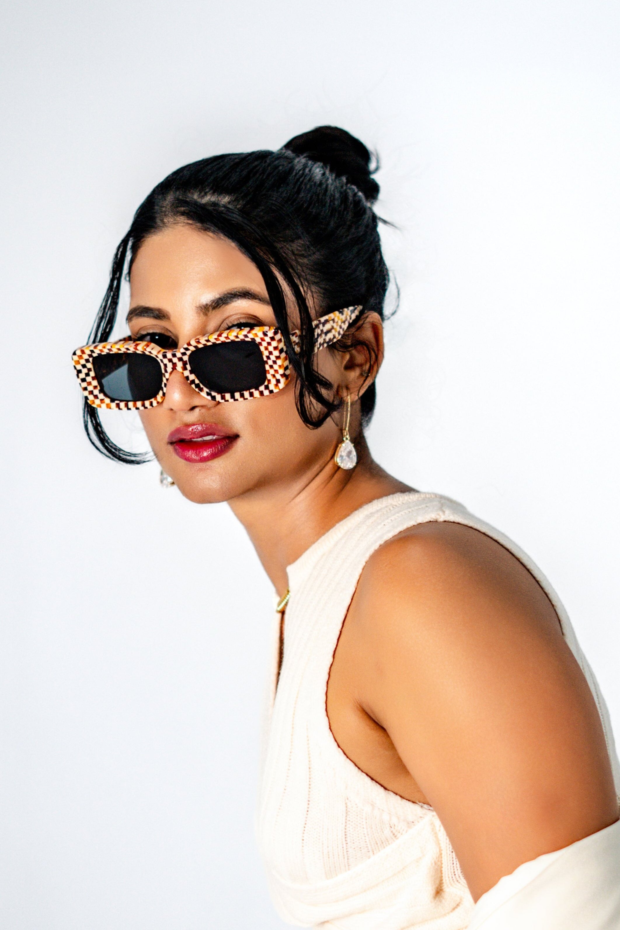 Model wearing Checkmate Orange unisex sunglasses – bold square frame fashion forward
